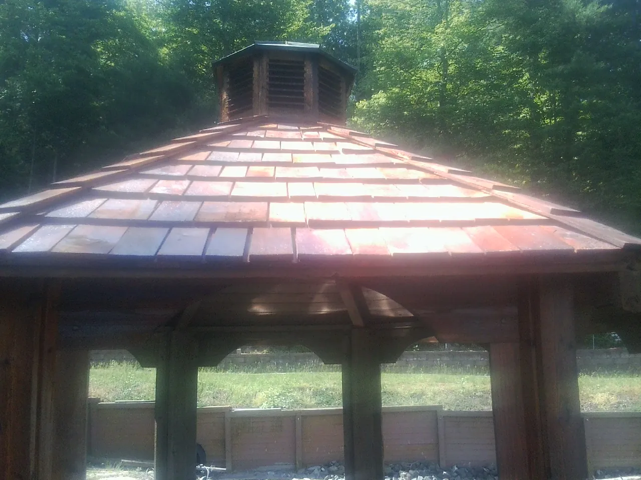 New cedar shake roof and cupola on a lakeside gazebo in Oriskany Falls